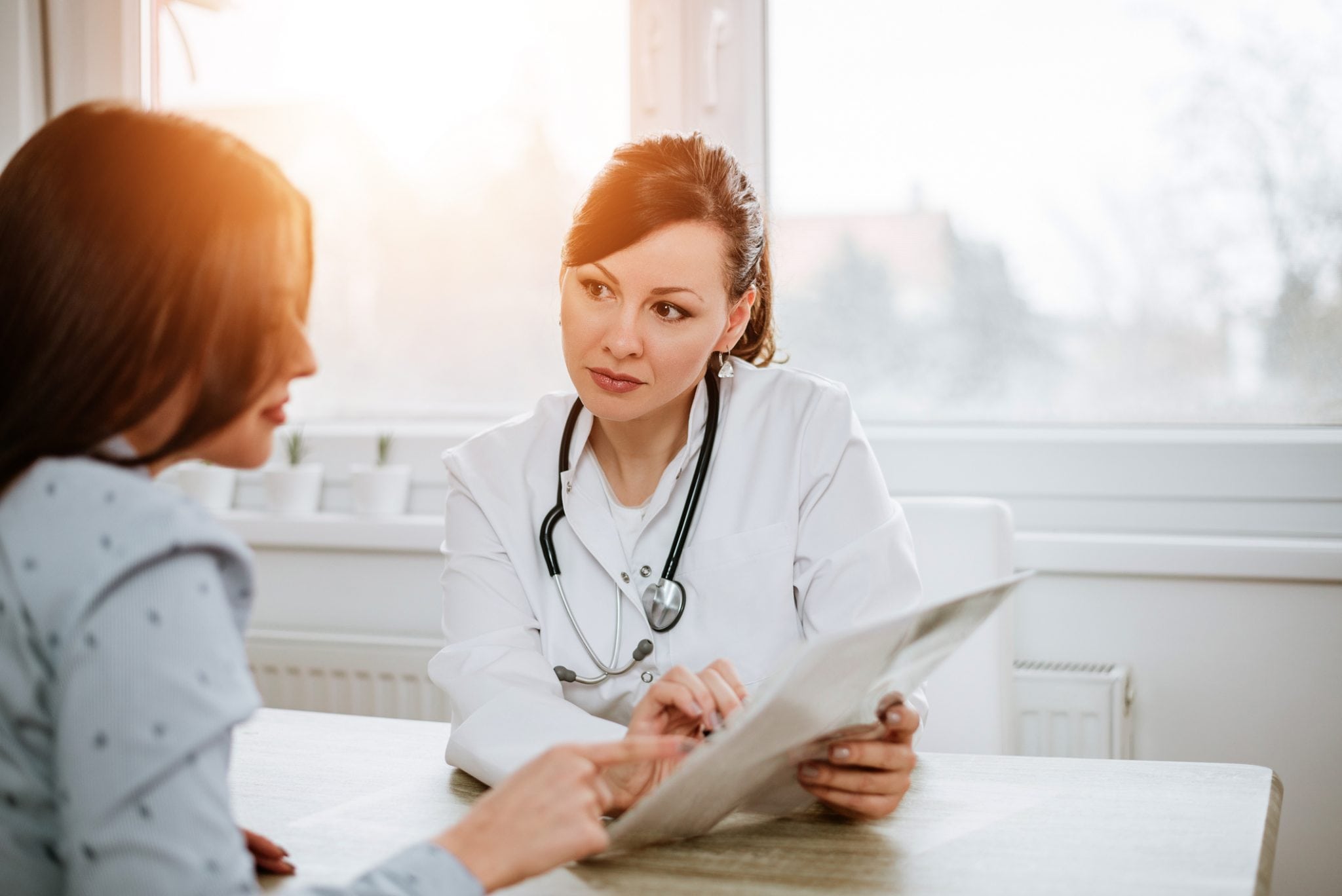 Doctor talking to her patients about breast cancer myths
